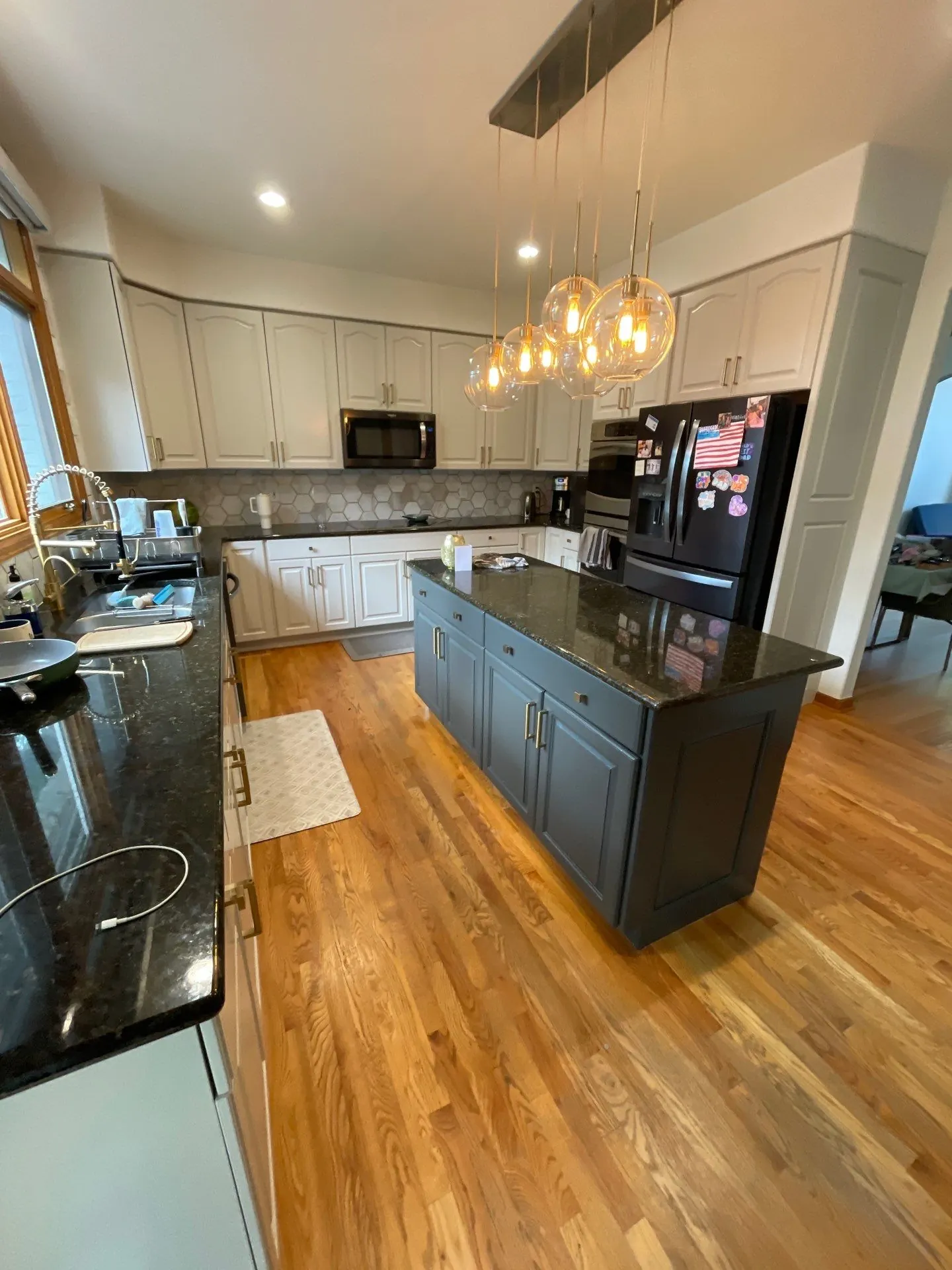 Littleton kitchen cabinets after repainting by Kind Home Painting